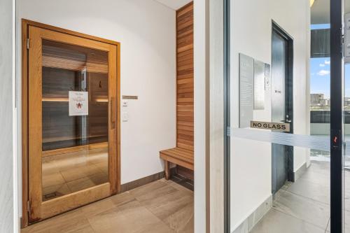 a door in a building with a sign on it at CBD Luxury River View & Fireworks 1Bed Apt The One in Brisbane