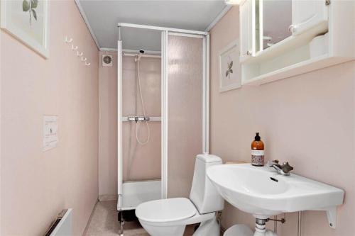 a bathroom with a toilet and a sink and a shower at KRO048-Urshult-Vaesterbotorp-Bosgard in Urshult