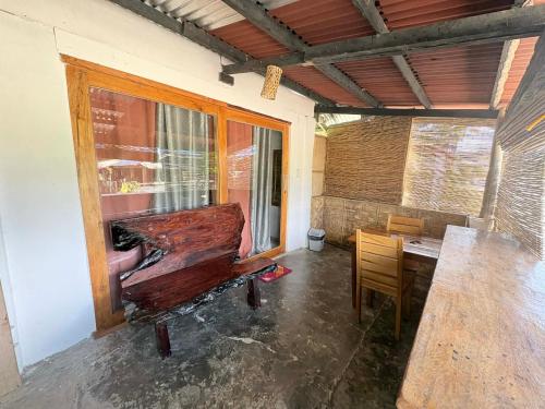 a piano sitting in a room with a table at Island - Escape Homestay in Burgos