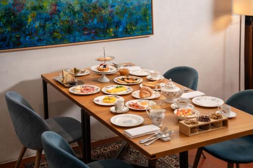a table with plates of food on it at Locanda Scotti in Paladina