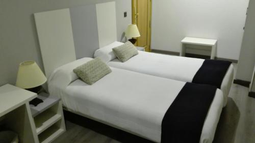 Ένα ή περισσότερα κρεβάτια σε δωμάτιο στο Hosteria La Moraleja