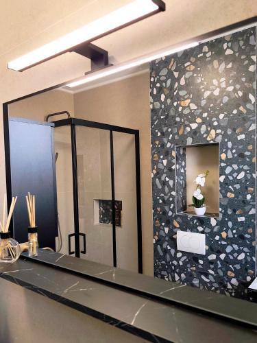 a large mirror in a bathroom with a sink at Nashi Garden Apartment Split with City View & Parking in Solin