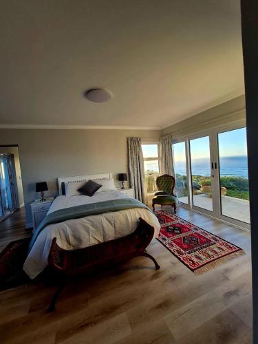 a bedroom with a bed with a view of the ocean at Guests at 32 Nautilus Bay in Dana Bay