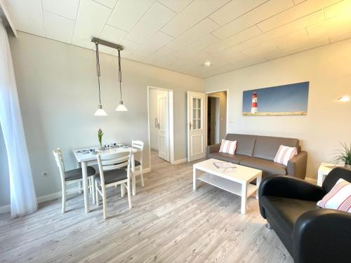 a living room with a couch and a table at App 12-A67 in Westerland