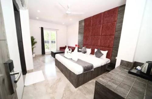 a bedroom with a large bed in a room at Hotel BR international in Tājganj