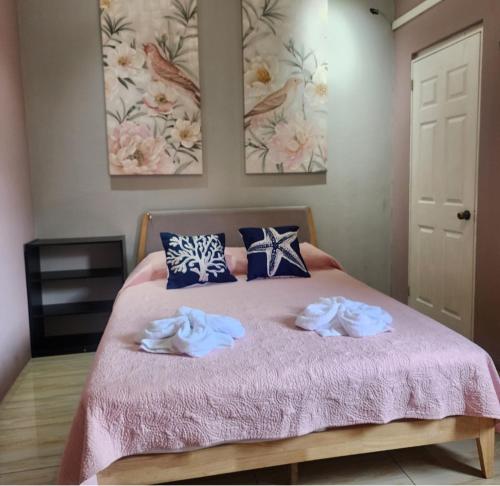 a bedroom with a bed with two towels on it at Casa Vidalta in San Sebastián