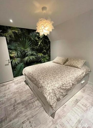 a bedroom with a large bed with a large mural at MiMa Vakantiewoning bij Tomorrowland in Boom