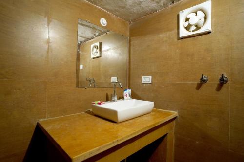 a bathroom with a white sink and a mirror at Royal Salma Resort A family Luxury Camp 