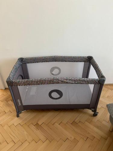 a large metal box sitting on a wooden floor at Mona Lisa Apartment in Bratislava