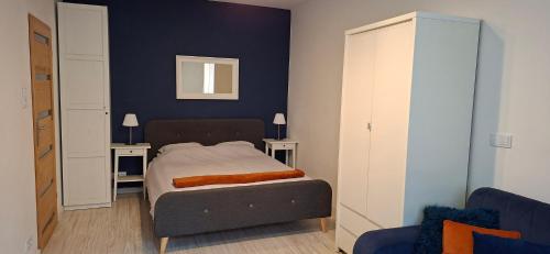 a small bedroom with a bed and two tables at 91 kroków - 91 steps free parking in Bolesławiec