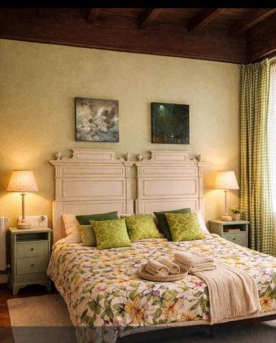a bedroom with a large bed with a large headboard at B&B Amarantha Gothica Genoa in Genoa