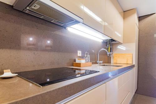 a kitchen with a sink and a counter top at Troia Ocean Breeze Villa in Troia