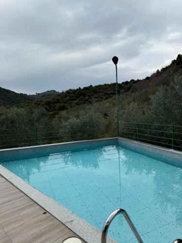 a swimming pool with a view of a mountain at Qyteza guest house in Shkodër