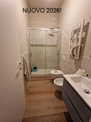 a bathroom with a shower and a toilet and a sink at A due passi dal mare in Roseto degli Abruzzi
