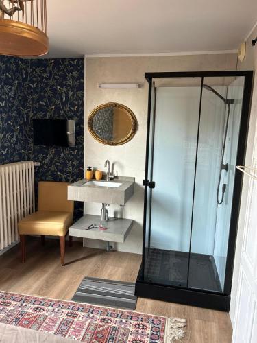 a bathroom with a shower and a sink at Vallee du Ton in Origny-en-Thiérache