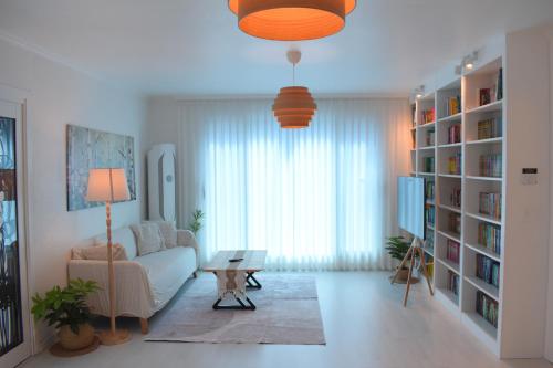 a living room with a couch and a table at RoseBrickHouse in Gwangju