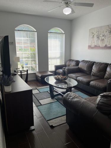 a living room with a couch and a table at 3 Bed 3 Bath Townhome in Tallahassee