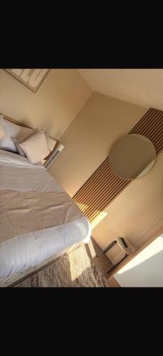 a bedroom with a bed in a room at Sundaes caravan rental in Kinmel Bay