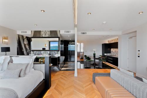 a bedroom and living room with a bed and a couch at Hotel San Carlu Citadelle Ajaccio in Ajaccio