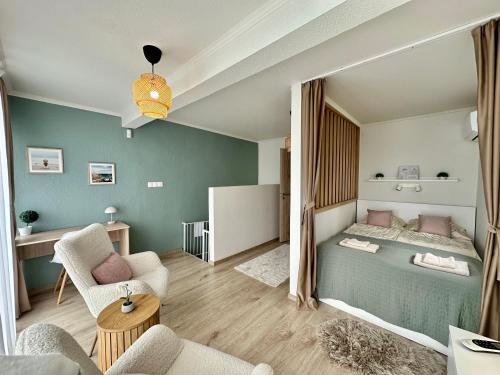 a bedroom with a bed and a living room at Sunny Private Beach in Balatonlelle