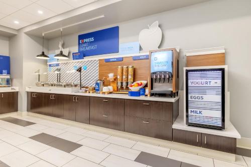 an apple store with a counter with an apple kiosk at Holiday Inn Express & Suites - Medford by IHG in Medford