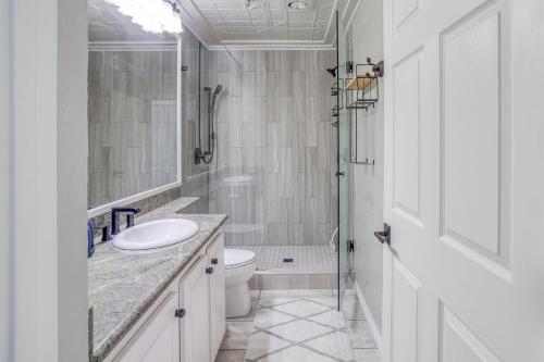 a white bathroom with a sink and a toilet at Fun Times At Nye Beach in Newport