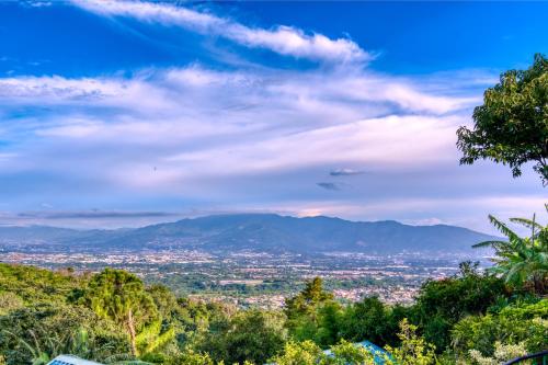 a view of a city from a hill at Buena Vista Chic Hotel in Alajuela