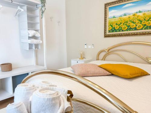 a bedroom with a bed with a painting on the wall at CasaLina Perfect House in Altamura