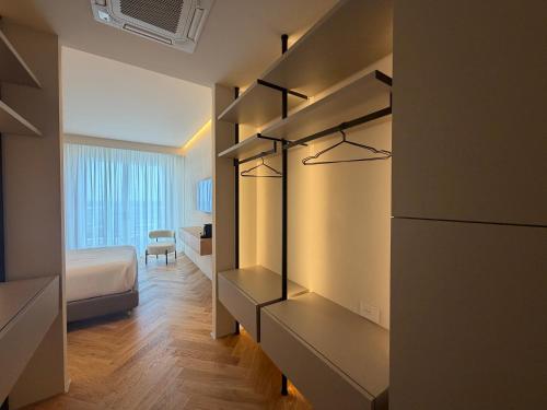 a room with a bedroom with a bed and a room with a bed sqor at Rumare - BADIA NUOVA in Trapani
