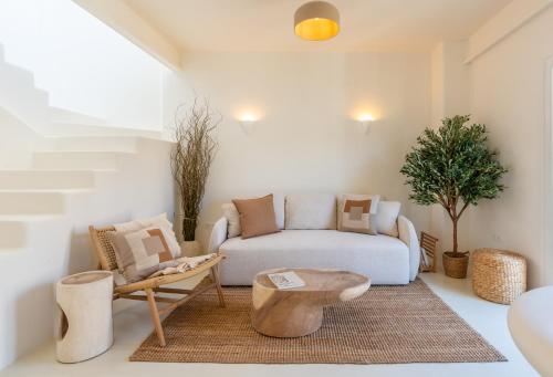 a living room with a couch and a table at Ático 360º con Piscina in Málaga