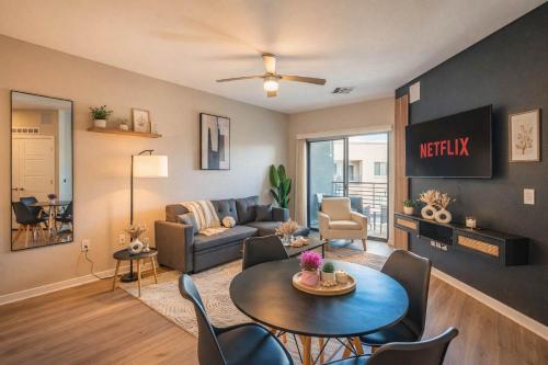 a living room with a couch and a table at Bright 1BR Uptown Biltmore Gym Pool Parking WD in Phoenix