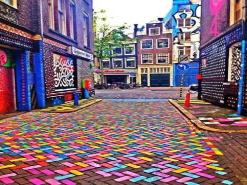 a city street with a colorful rug on the ground at Sonia Flats Pipa's Bay - Flat 211 in Pipa