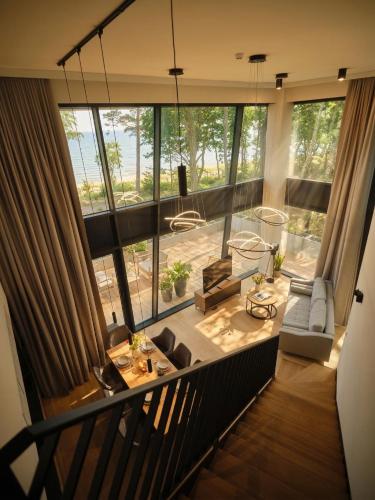 a view of a living room with a large window at Baltic Jet Luxury Aparthotel in Ustronie Morskie