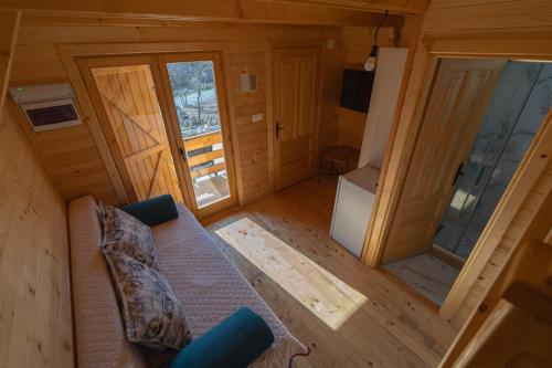 an overhead view of a living room of a wooden cabin at Apartmani Perosevic in Danilovgrad