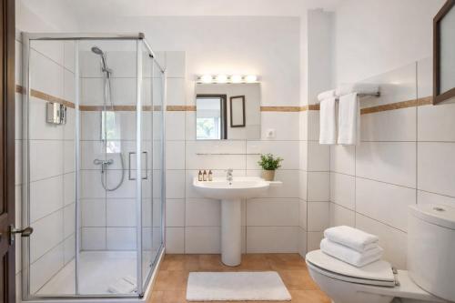 a bathroom with a shower and a sink at Primavera House Port Sóller formerly Sol Port Sóller in Port de Soller