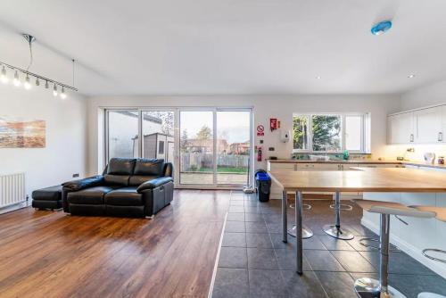 a living room with a couch and a table at Park 1 in London