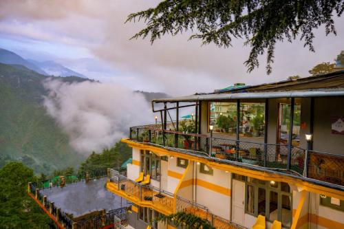 a hotel with a view of the mountains at PACK Mcleodganj in McLeod Ganj
