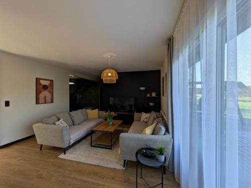 a living room with a couch and a table at Chill House in Zator
