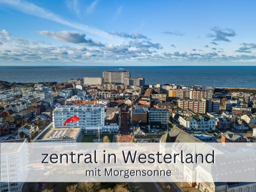a view of a city with the ocean in the background at Skriien Mö TOP-Fewo 4 Sterne 5 Min zum Strand Balkon 2 SZ TG Zentrum in Westerland