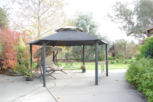 
a picnic table with an umbrella on top of it at Getawaytoaljon in Mansfield

