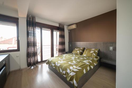 a bedroom with a bed and a large window at Villa White Lake - Ohrid Center Lakeside Accommodation in Ohrid