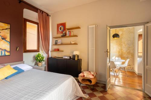 a bedroom with a bed and a table in it at Luna Nova in Meina