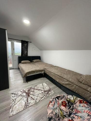 a bedroom with two beds on the floor at L&L in Sarajevo