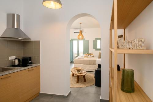 a kitchen and a living room with a bedroom at Le Reve in Aegiali