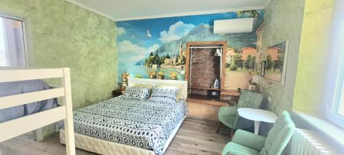 a bedroom with a bed and a painting on the wall at B&B Le Palme in Appiano Gentile