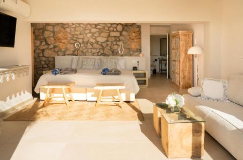 a living room with a bed and a couch at Villa Maya Bali Inspired Villa in Mijas