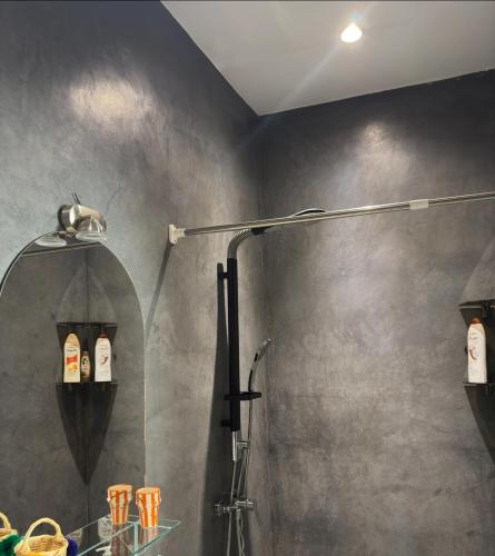 a shower stall in a bathroom with a shower at Maison Mamdy Triplex & Rooftop in Marrakesh