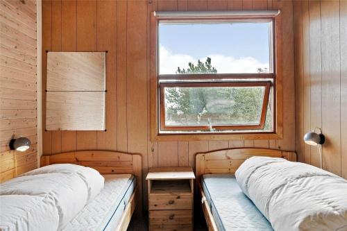 two beds in a room with a window at 30711-Odder-Skovgardsparken-1 in Odder