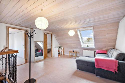 a living room with a couch and a bed at 10253-Ulfborg-Sognegardsvej-13 in Ulfborg