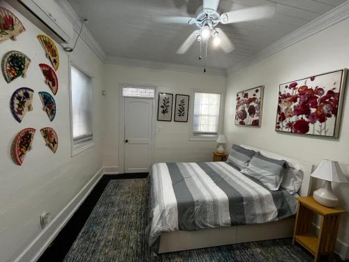 a bedroom with a bed and a ceiling fan at Downtown Nassau Oasis Unit 2 in Nassau